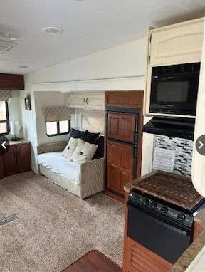 kitchen and family room inside of 5th wheel trailer